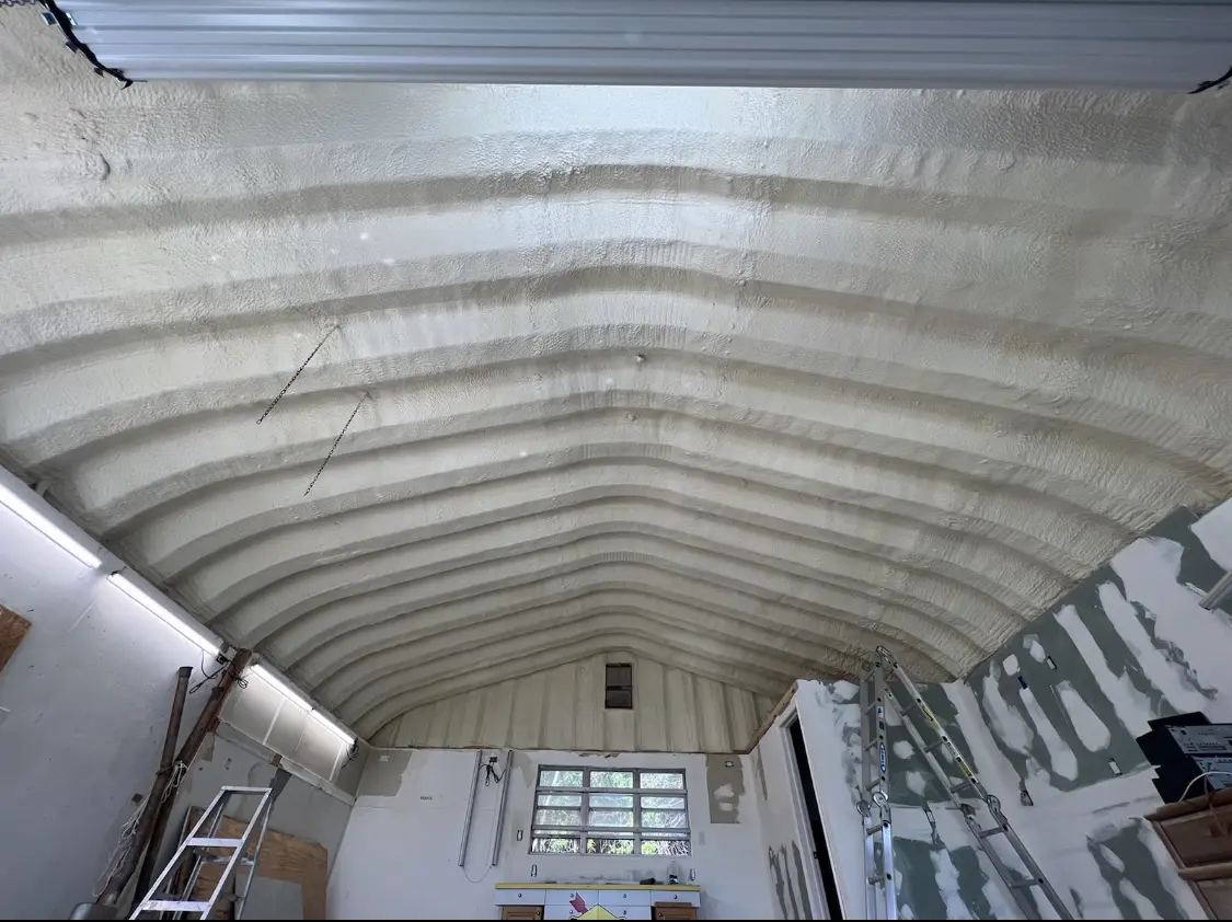 Spray polyurethane foam applied to the underside of a metal roof deck in Bruce
